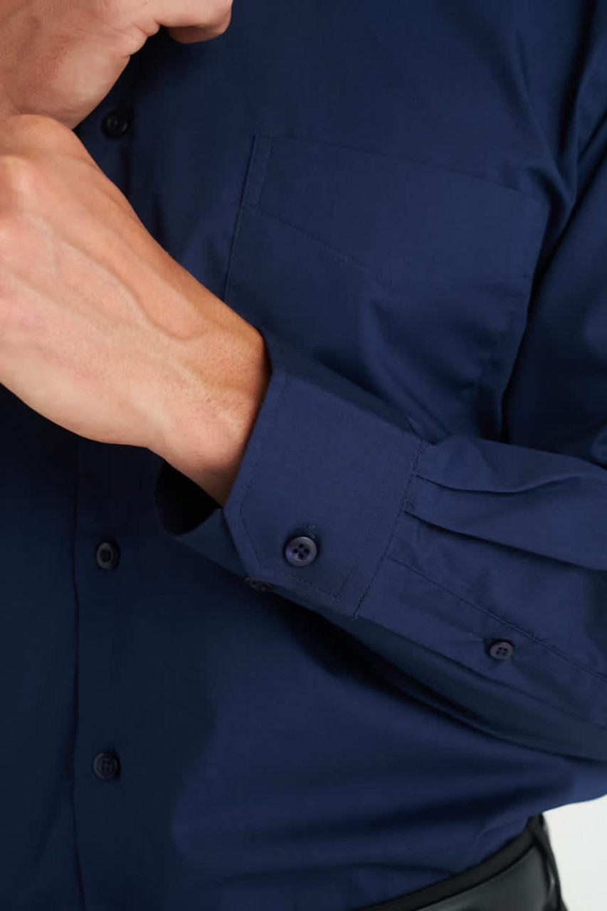 A navy blue men's long sleeve button-up shirt featuring a chest pocket and buttoned cuffs.