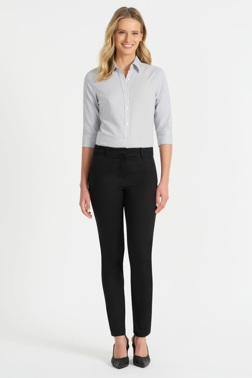 A woman is wearing a grey button-up shirt with 3/4 sleeves and black trousers, standing on a plain background.