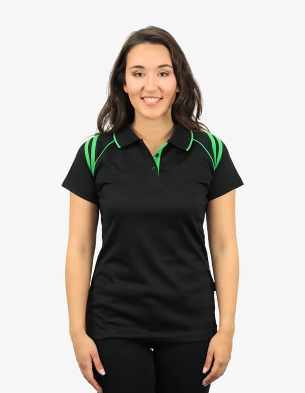A black polo shirt with green accents and a logo on the chest, modelled by a smiling woman.