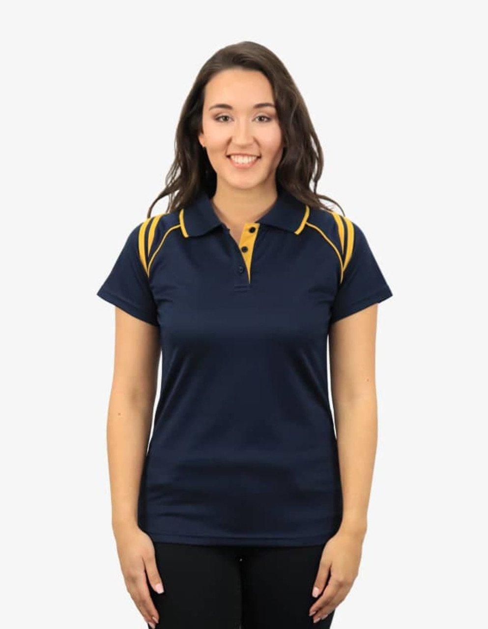 A navy polo shirt featuring yellow accents, modelled by a smiling woman. The shirt has a collar and a logo.