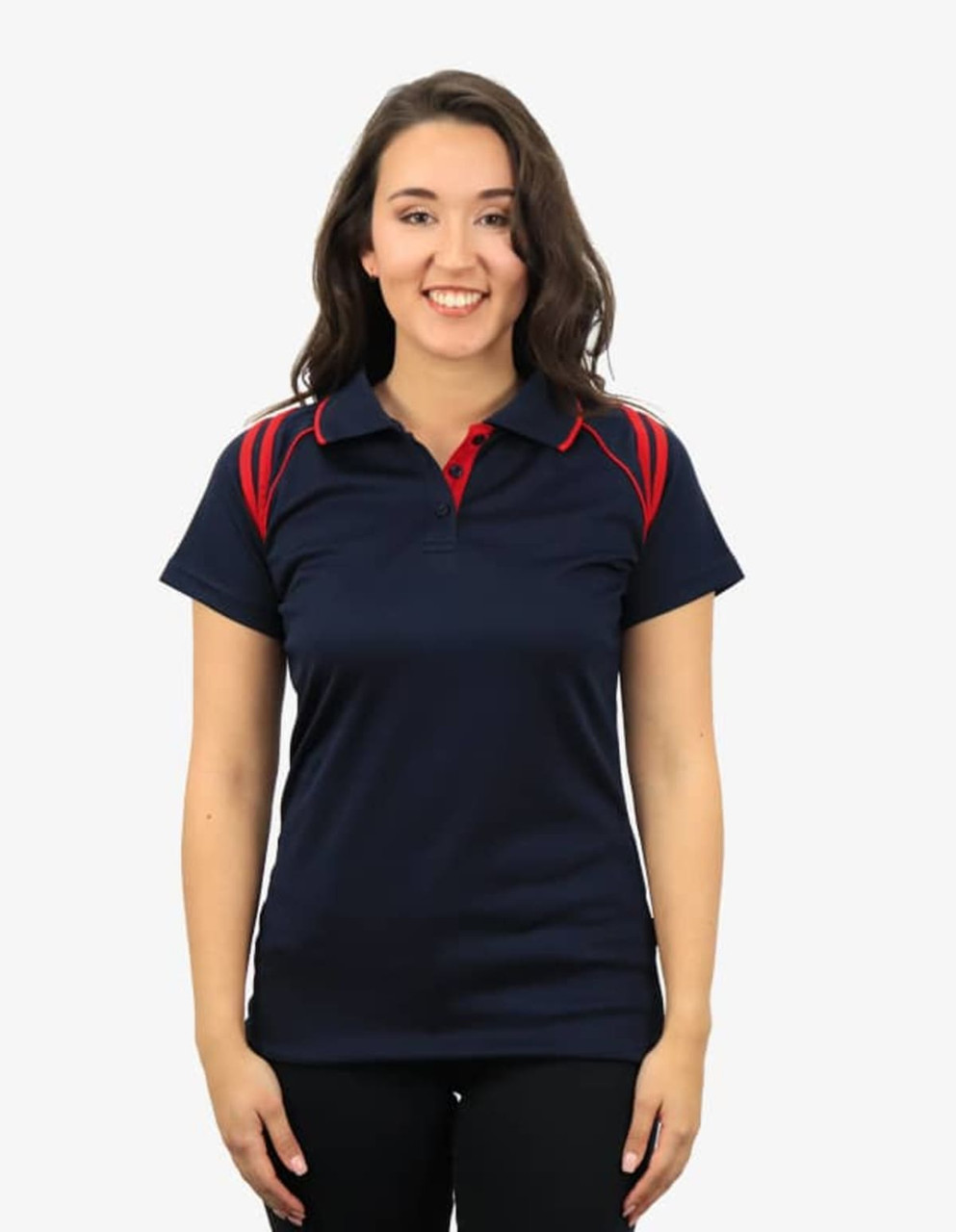 A navy polo shirt featuring red accents, worn by a smiling model. The shirt has a logo on it.