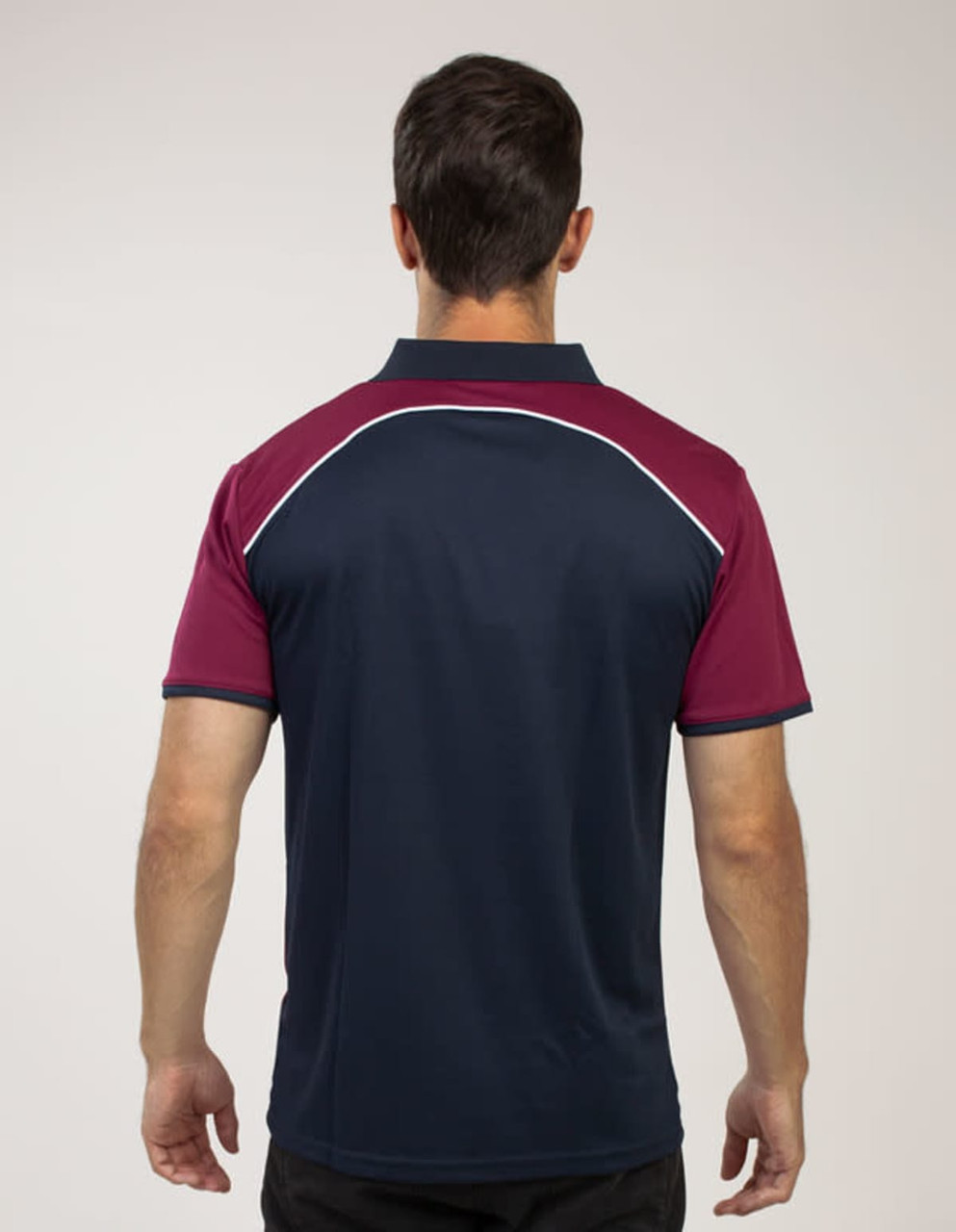 A navy and maroon polo shirt featuring a logo, viewed from the back.