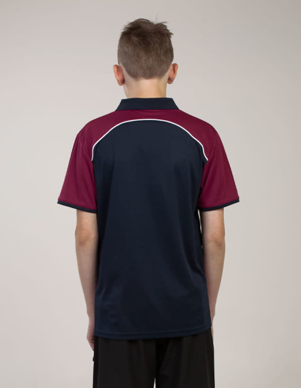 A back view of a polo shirt featuring navy blue and maroon colours with a logo on the side.