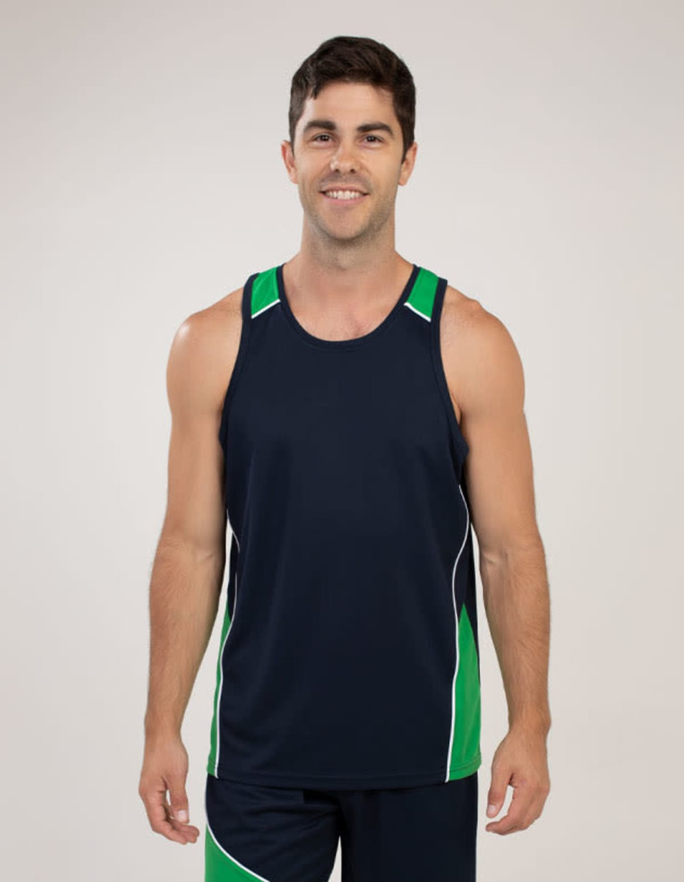 A man in a navy singlet with green and white accents, featuring a logo on the chest.