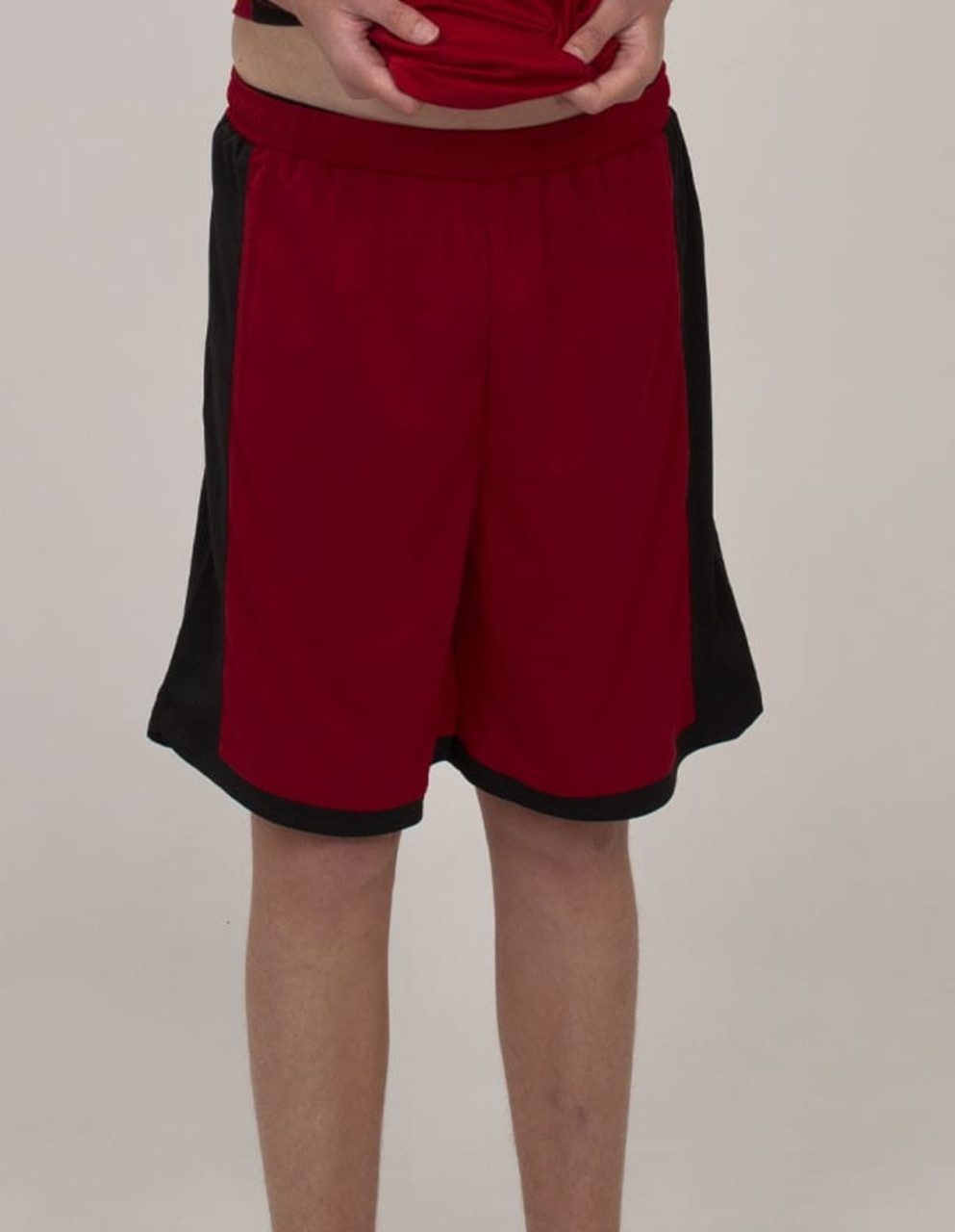 Red sports shorts with black side panels, featuring an elastic waistband and a logo.