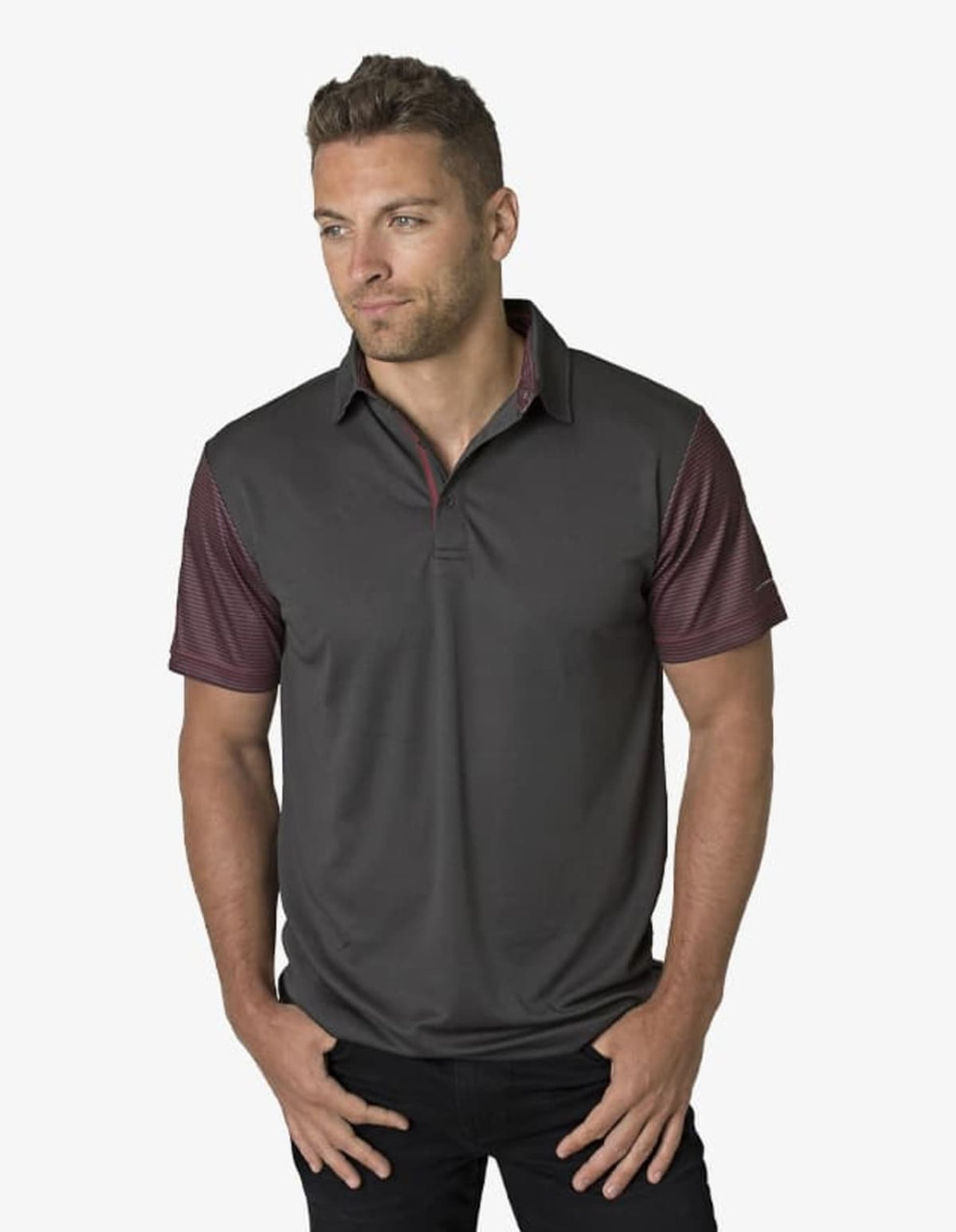 A grey polo shirt with maroon patterned sleeves and a logo on the chest. Worn by a man posing confidently.