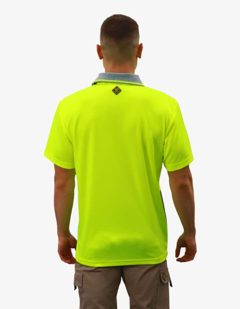 A bright yellow polo shirt with a grey collar, featuring a logo on the back.