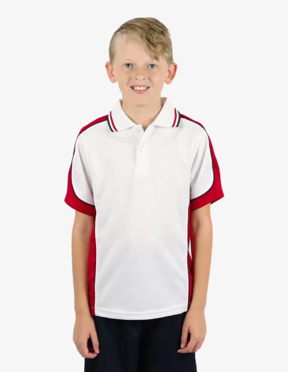 A boy smiles while wearing a white polo shirt with red sleeves and a logo on the chest.