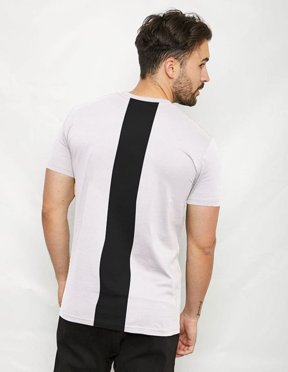 A T-shirt featuring a white body with a black back panel, showcasing a simple and modern design.
