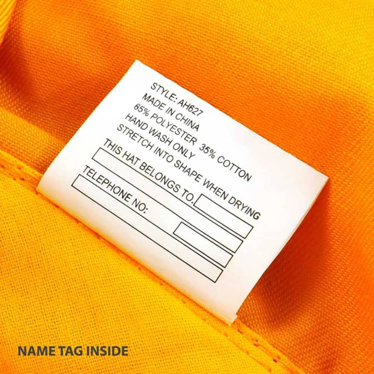 A yellow Legionnaire cap with a care label featuring instructions and a name tag.