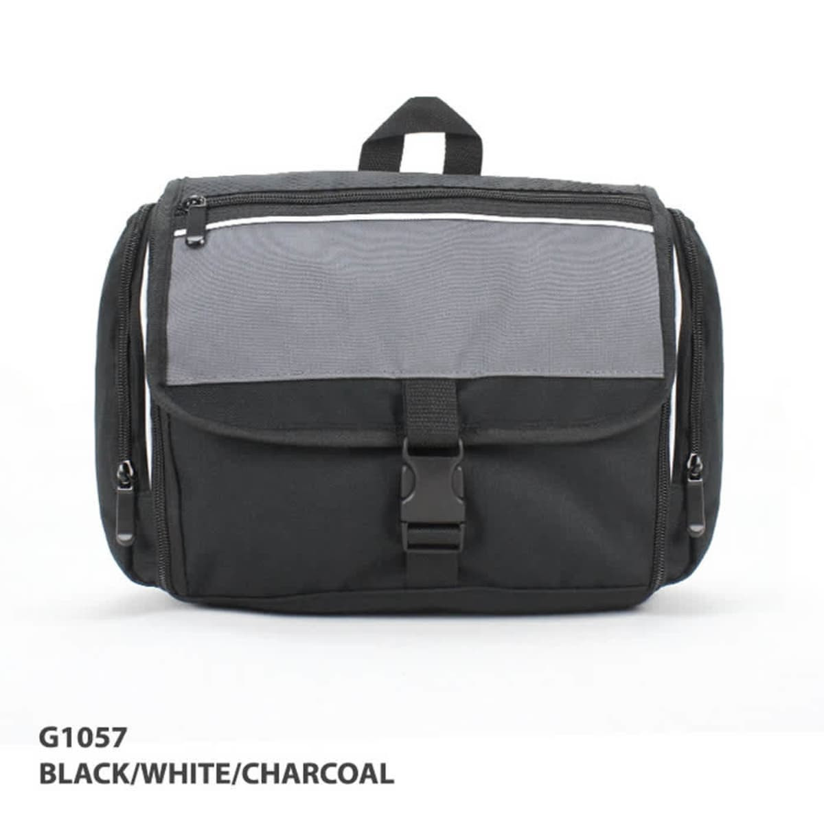 A toiletry bag in black with grey accents, featuring a front buckle and zippers, along with a handle on top.