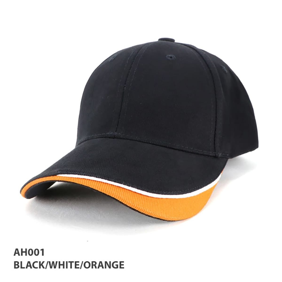 A black cap with white and orange detailing, featuring a curved brim and a logo on the front.