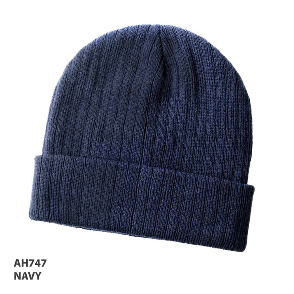 A navy wool blend beanie with a ribbed texture and a folded cuff. It features a logo.