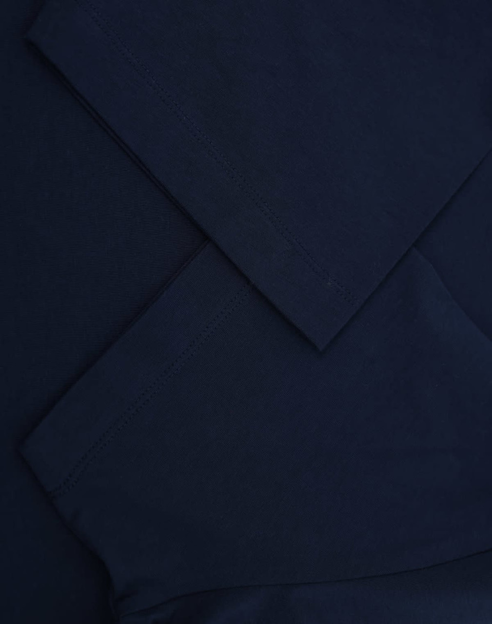 A navy blue premium cotton short-sleeve T-shirt with neatly folded sleeves. It features a logo on the fabric.