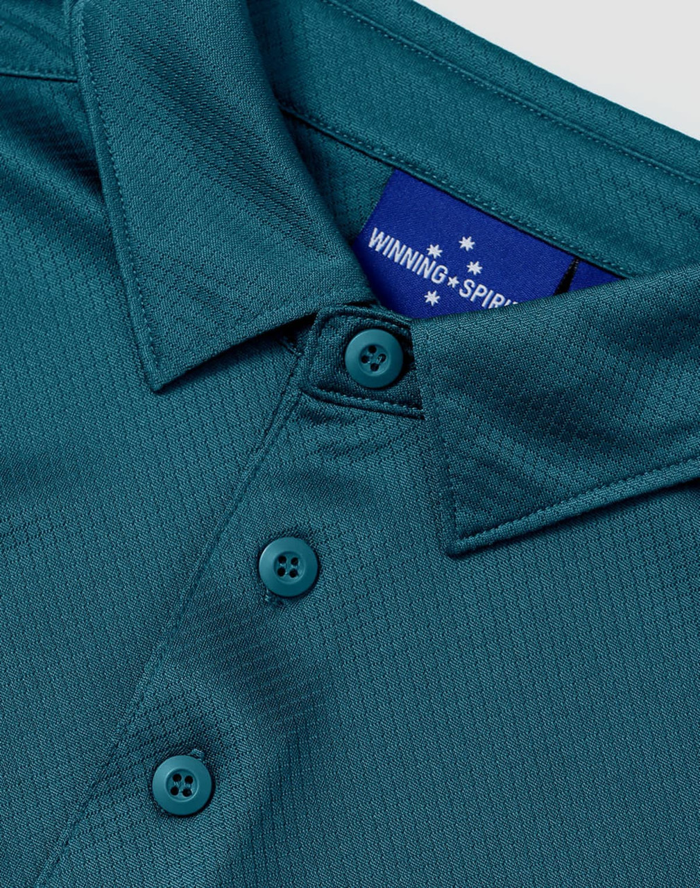 A teal sustainable jacquard knit short sleeve polo featuring a collar and button detail, with a logo on the inside.