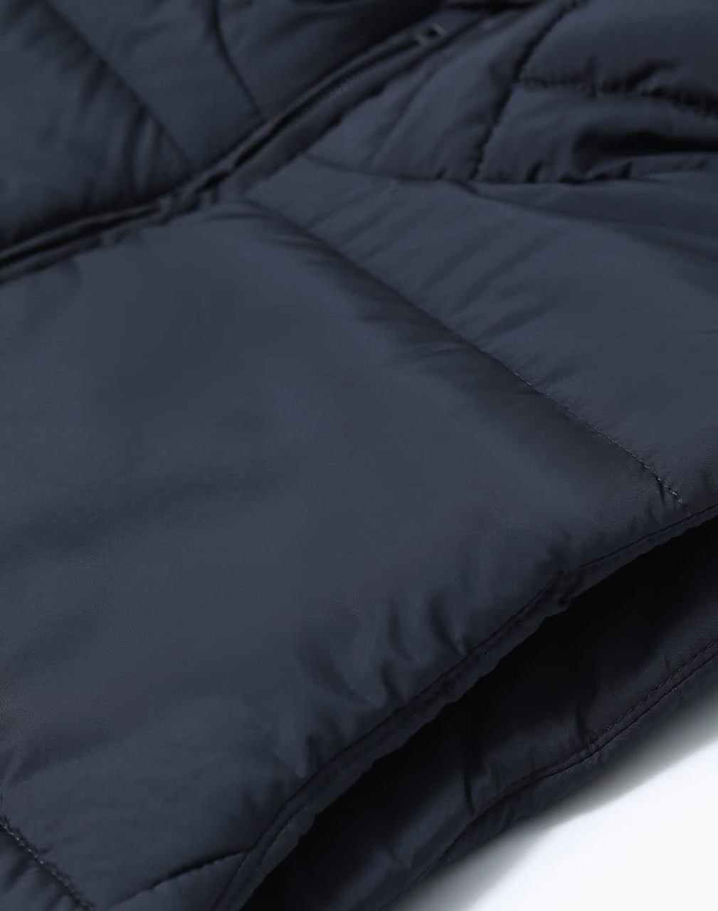 Men's sustainable insulated puffer vest in navy, featuring a soft, textured fabric and a zip closure.