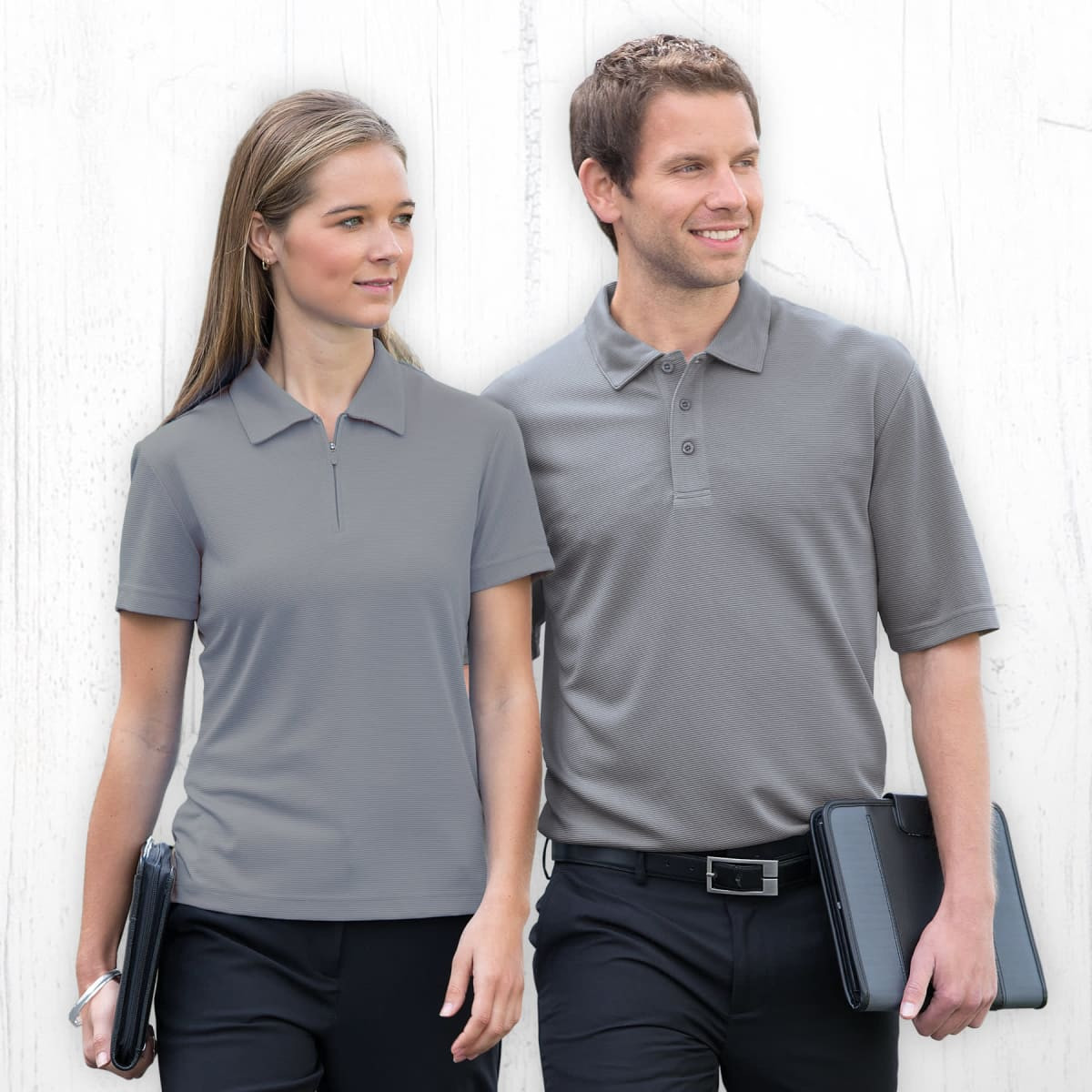 A grey polo shirt for men, featuring a collar and short sleeves, displayed with a male model and a female model.