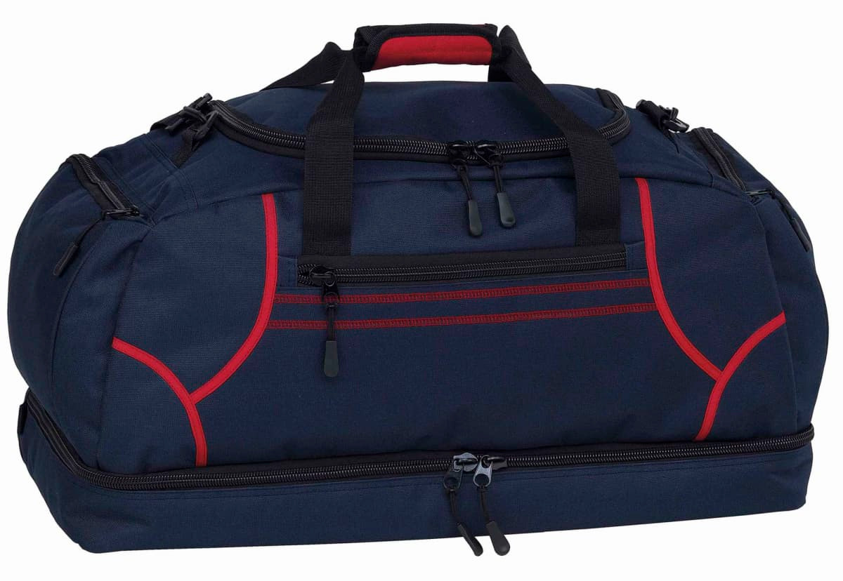 A navy blue duffle bag with red accents and a logo, featuring dual handles and zippered compartments.