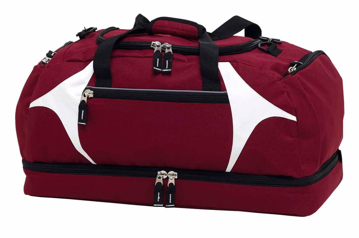 A maroon duffle bag with white accents and multiple zipper compartments, featuring a logo.