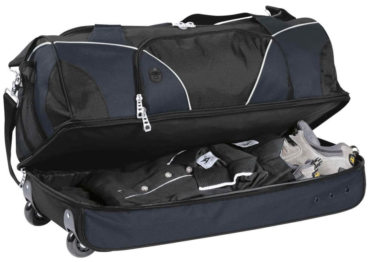 A wheeled travel bag in black, partially open, revealing grey and black clothing inside. It has a logo on the side.