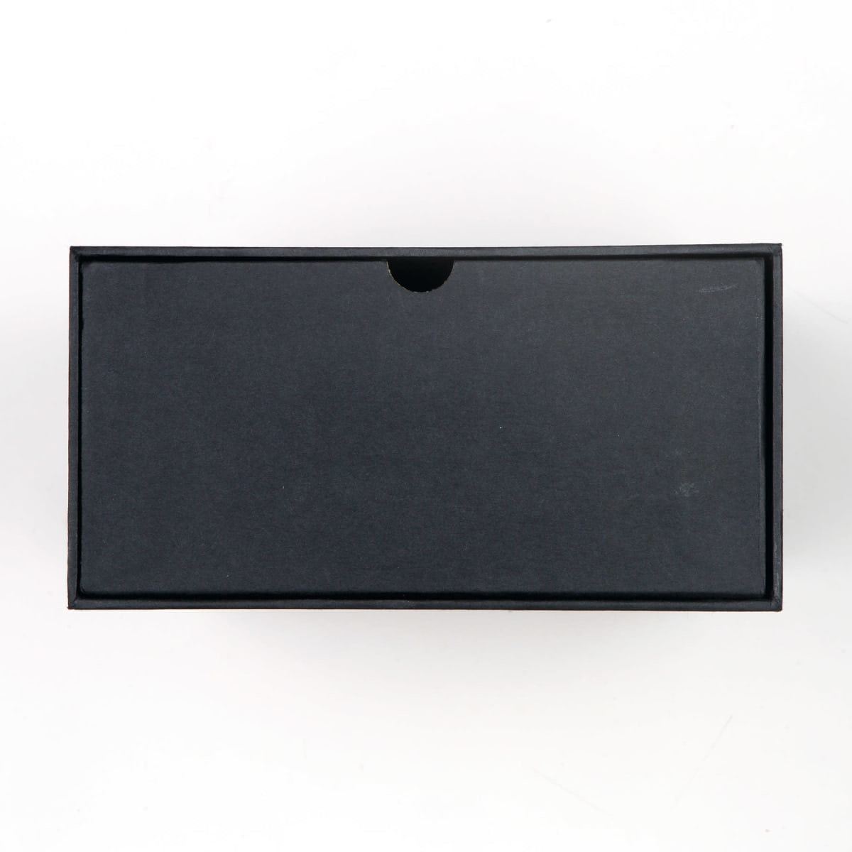 A black box with a minimalist design, suitable for packaging a wine glass set.