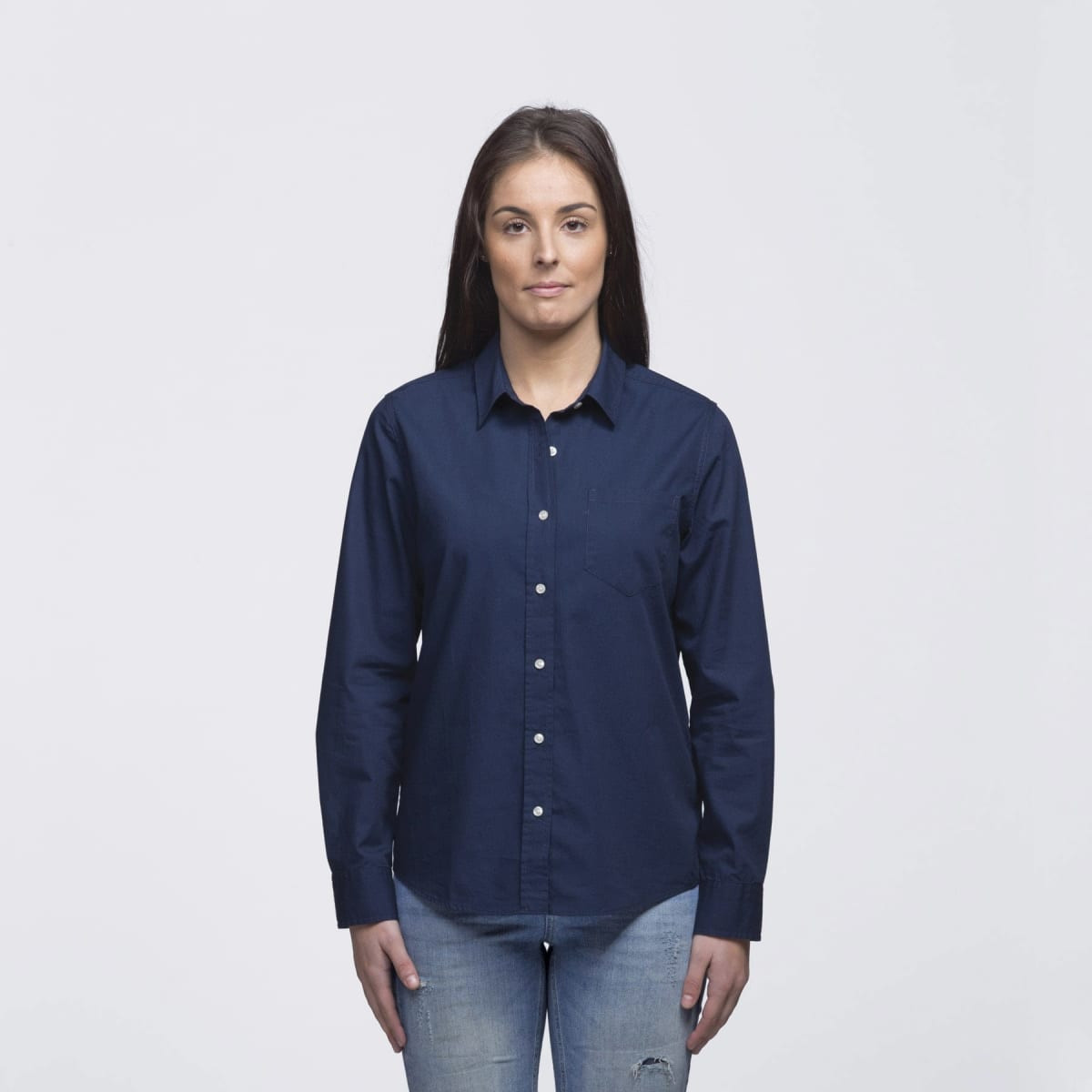 A navy blue button-up shirt for women, featuring a collar and long sleeves, displayed on a model.