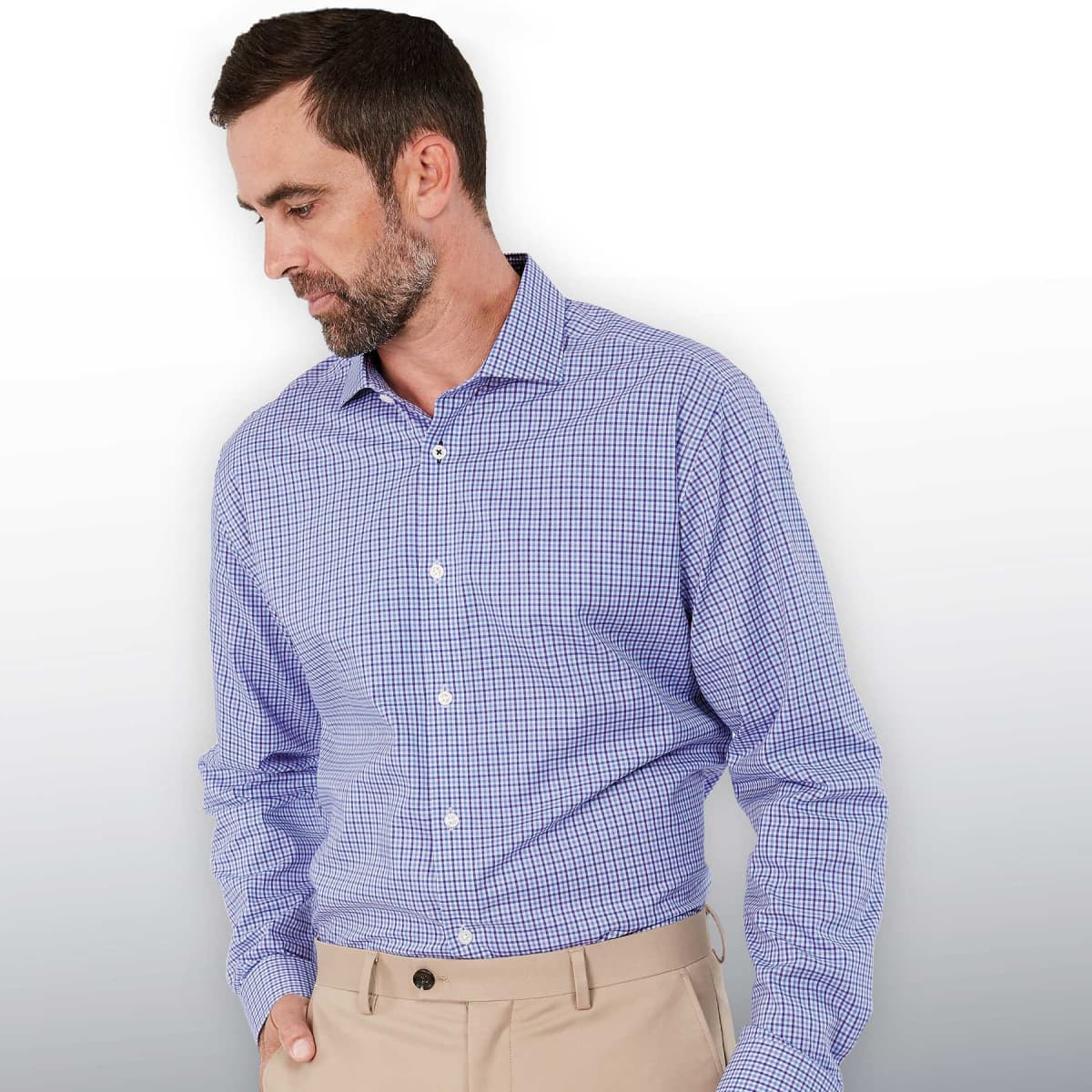 A men's button-up shirt in a blue check pattern, featuring a collar and long sleeves. It has a logo on the chest.