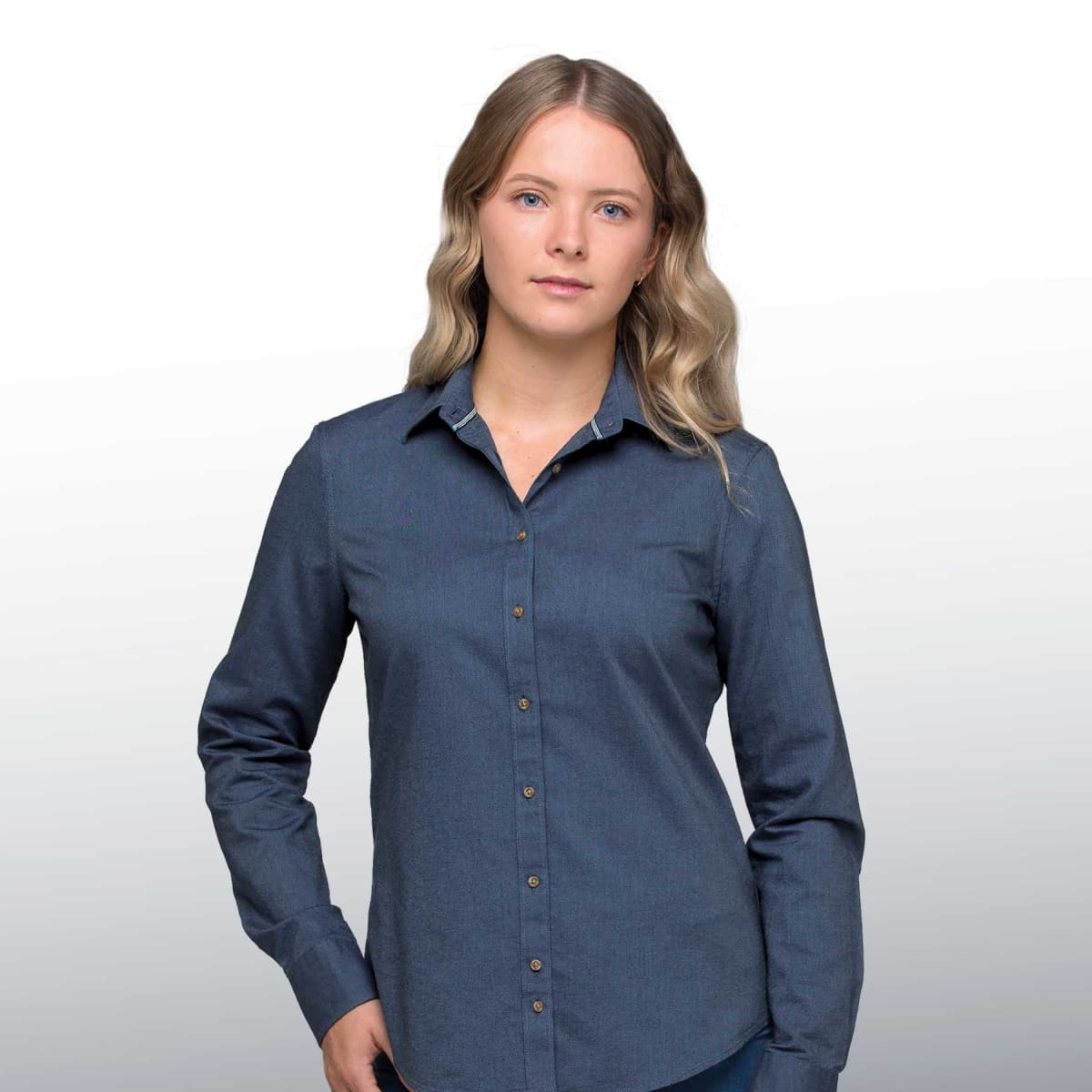 A blue button-up shirt for women, featuring a classic collar and button closure, with a logo present.
