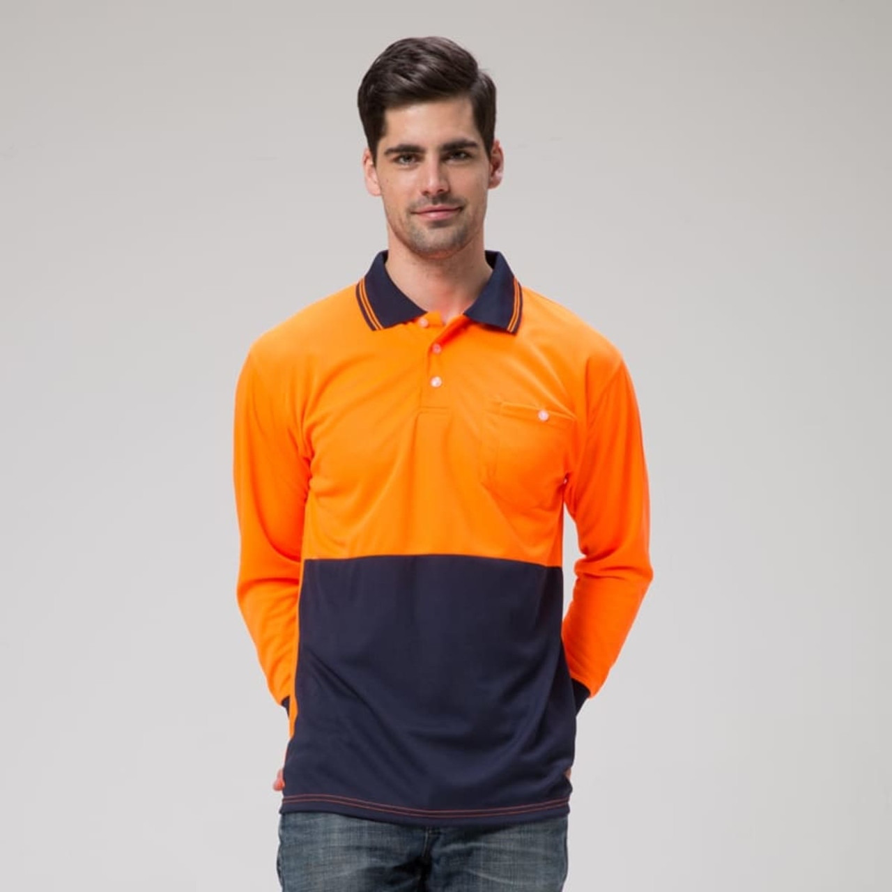 A long-sleeved polo in orange and navy, featuring a pocket and a logo.