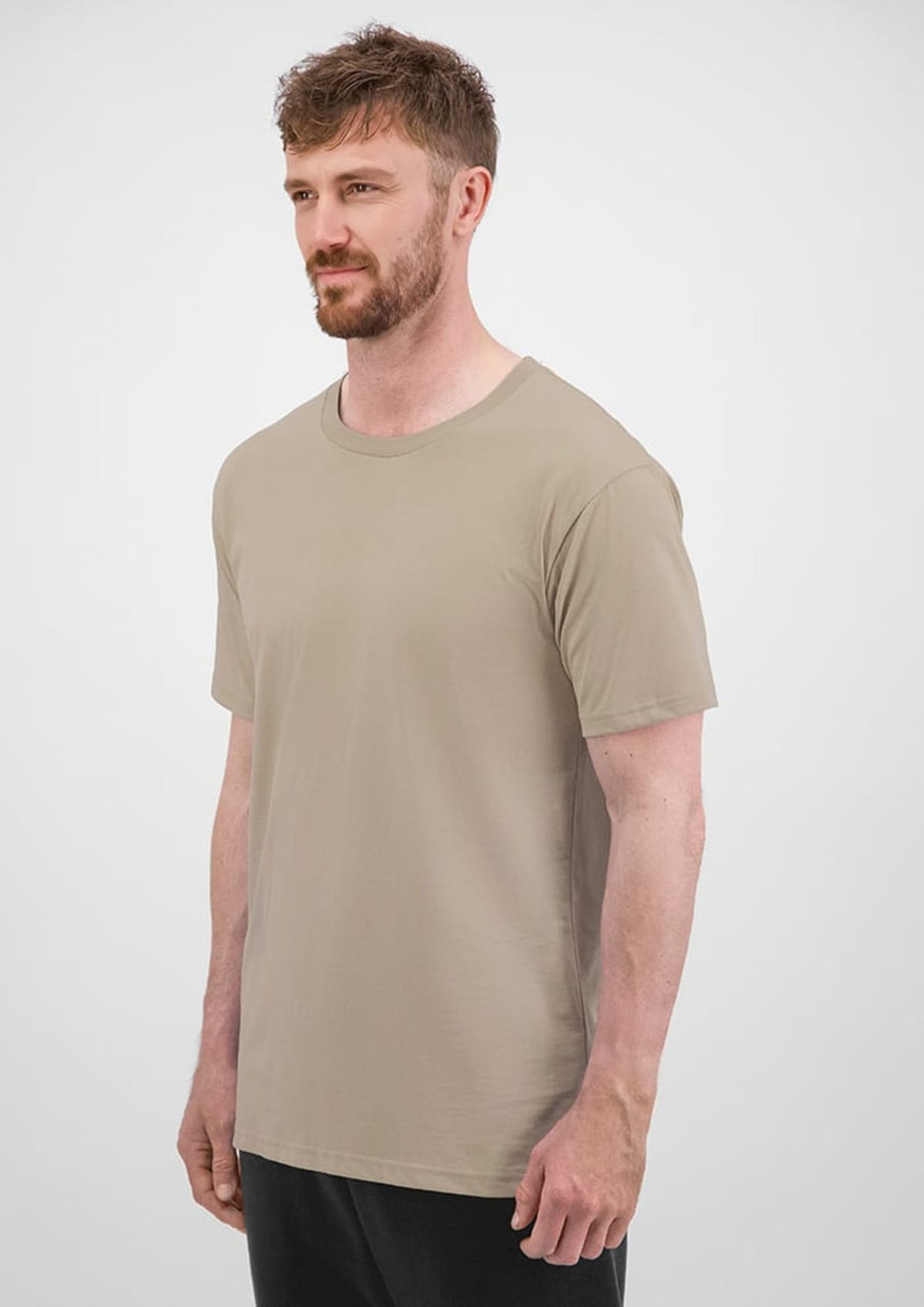 A short sleeve tee in a beige colour, featuring a logo, displayed on a male model against a neutral background.