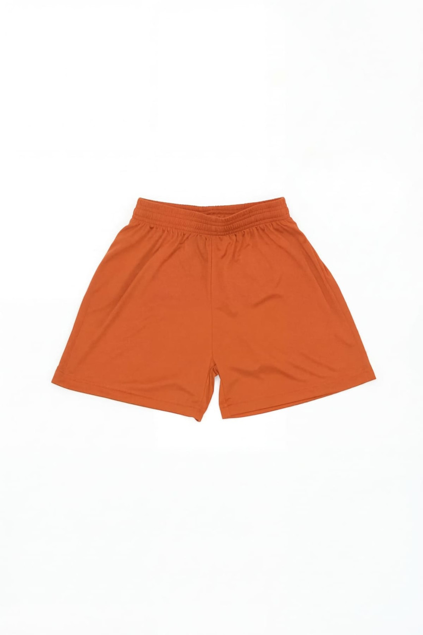 Youth Core Shorts in bright orange with an elastic waistband and a simple design. Features branding.
