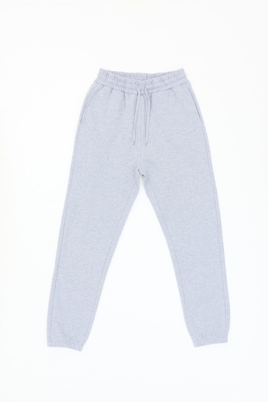 Light grey everyday track pants with an elastic waistband and cuffs, featuring a drawstring detail.
