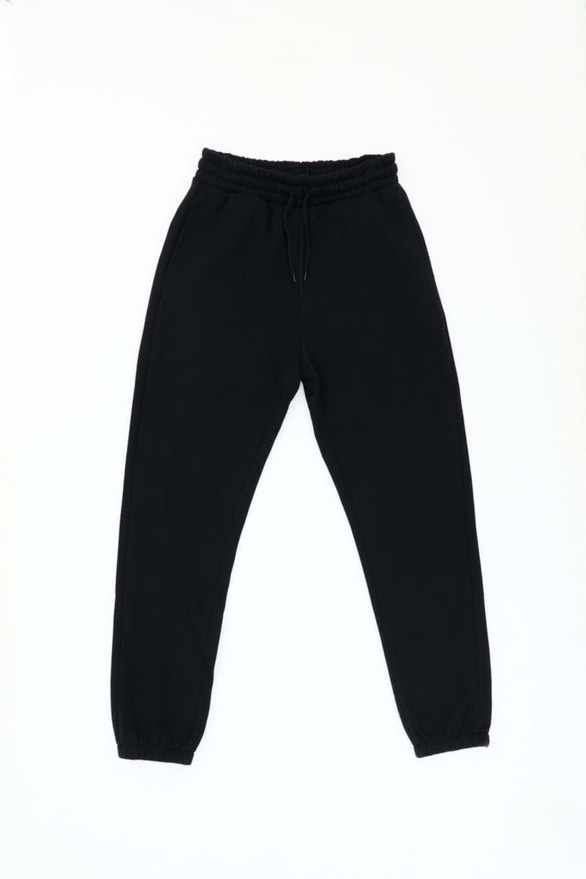 Black track pants feature an elastic waistband and cuffs, designed for comfort and casual wear.