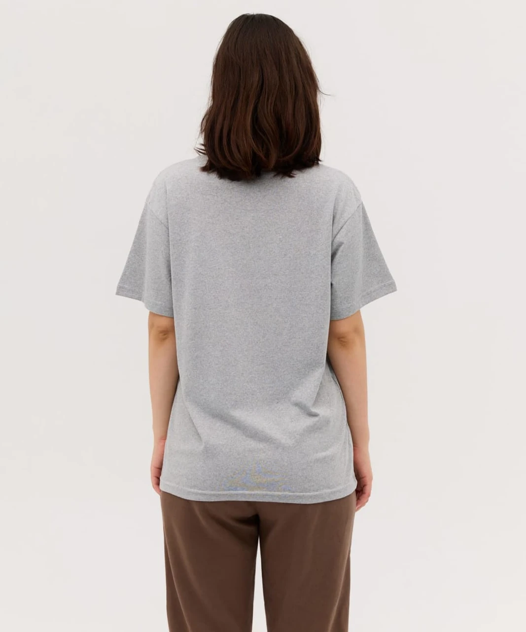 A grey t-shirt with short sleeves, displayed from the back view. The garment features a logo on the back.