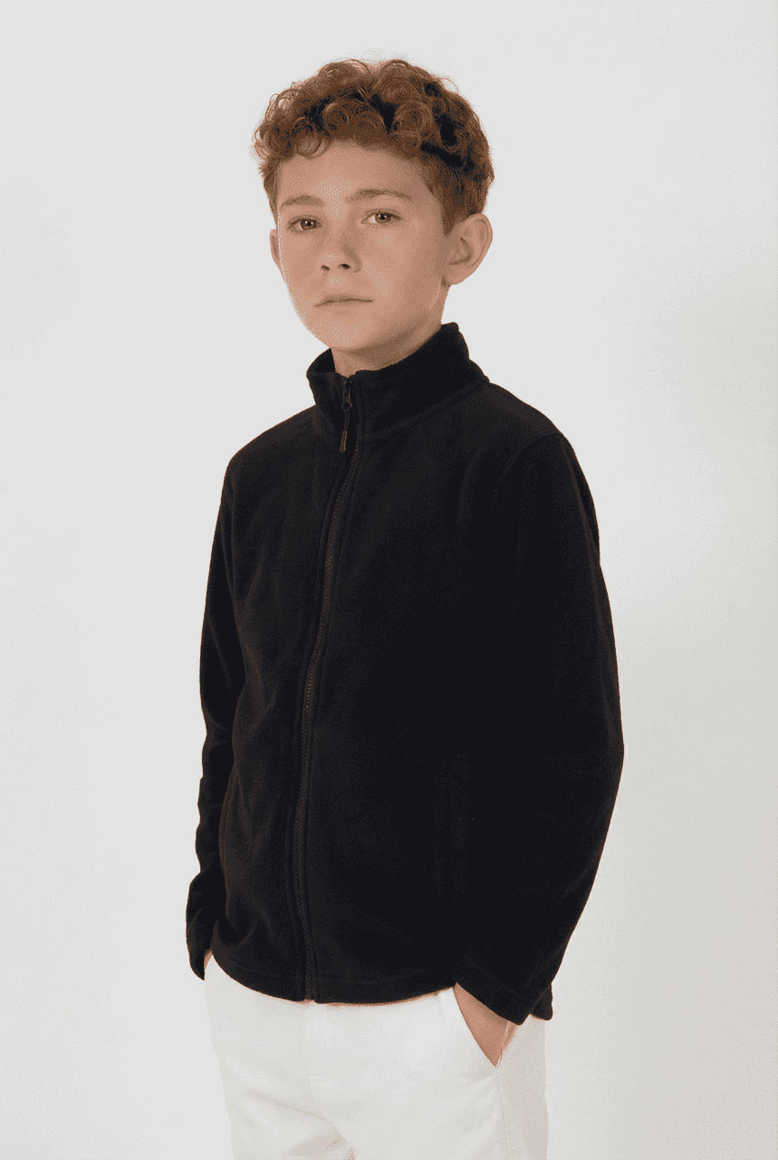 A youth wearing a black polar fleece full zip jacket, with a high collar and zippered front pockets.