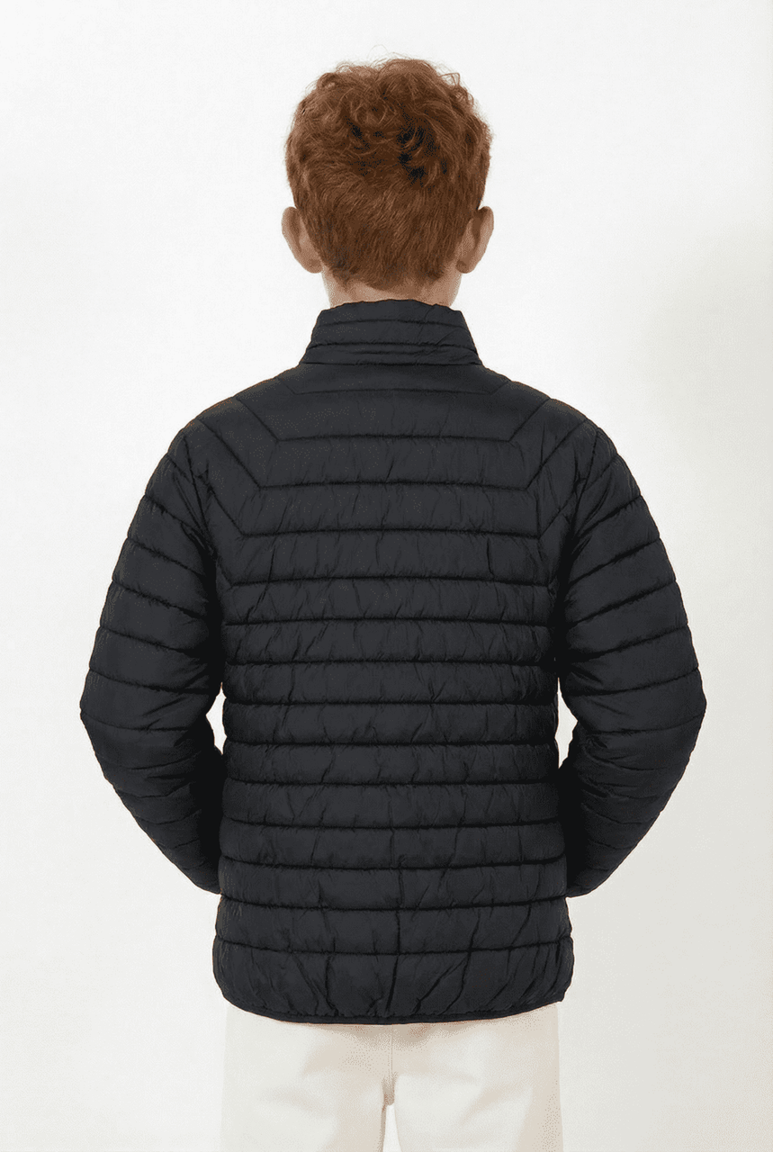 A back view of a black youth puffer jacket with a quilted design and a collar. Features a logo on the jacket.