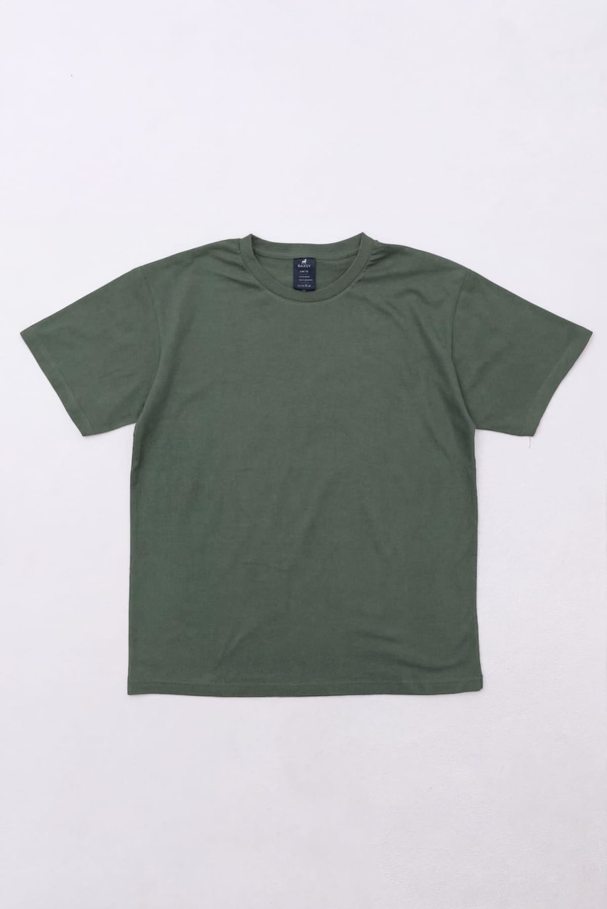 A green essential tee featuring short sleeves and a simple design, with a brand logo on the neck.
