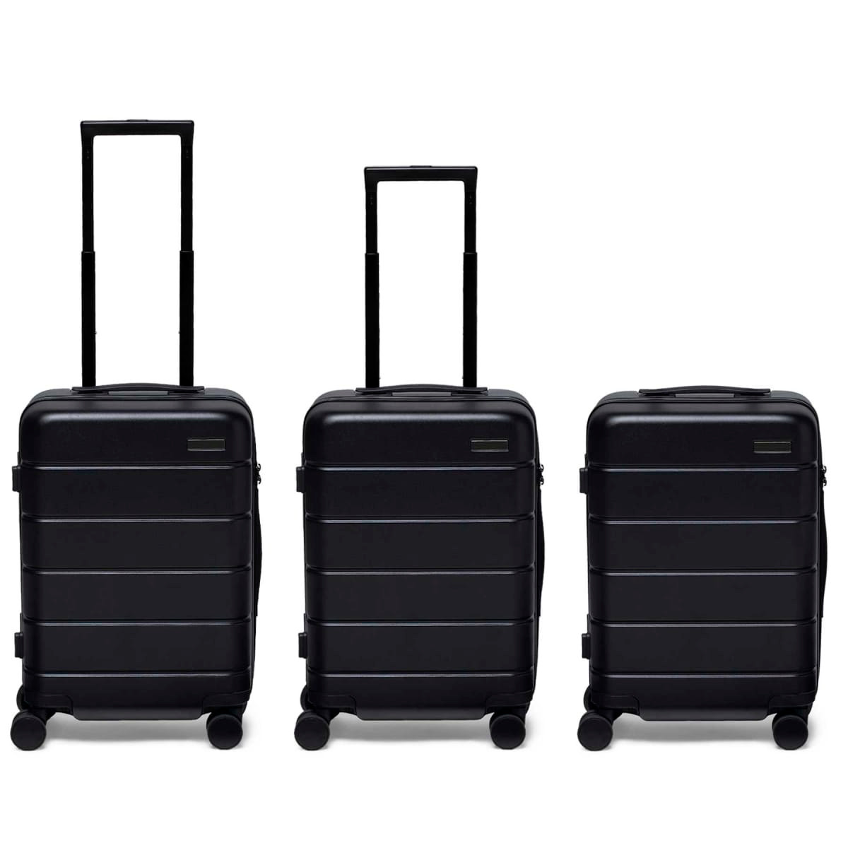 Three black hardcase suitcases with extendable handles and wheels, featuring a logo on the front.