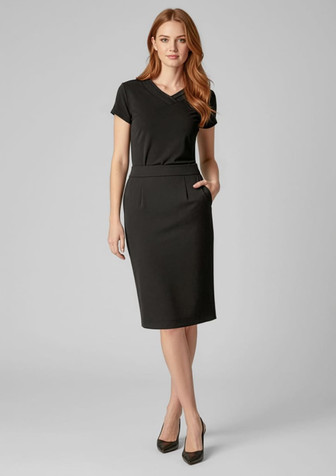 A below-knee black skirt with a fitted design and pockets, worn by a model with long hair.