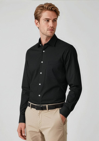 A black long sleeve button-up shirt worn by a model, featuring a sleek design and a collar, paired with beige trousers.