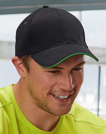 A black cap with a curved brim and red detailing, featuring a logo on the side.