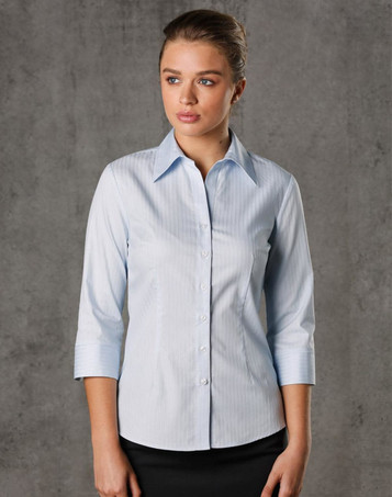A light blue women's 3/4 sleeve button-up shirt with a self-stripe pattern and a logo.