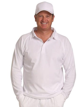 A long-sleeved white cricket polo shirt displayed on a smiling man wearing a matching white cap.