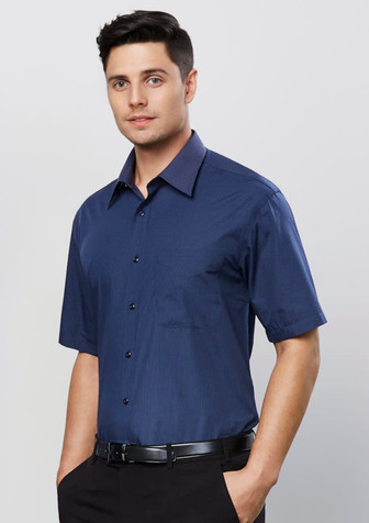 A dark blue short sleeve button-up shirt with a micro check pattern and one breast pocket. Features a logo on the shirt.