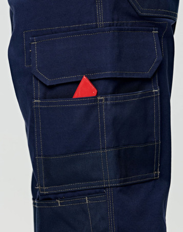 Navy blue semi-fitted Cordura work pants featuring multiple pockets, including a visible pocket with a red item.