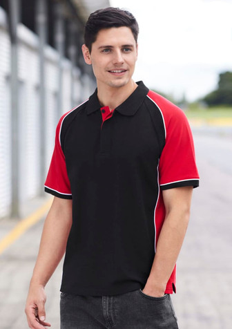 A short sleeve polo shirt in black with red sleeves and white piping, featuring a logo on the chest.