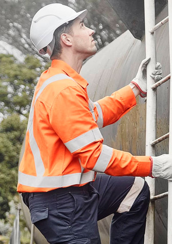 A man wearing an orange flame lightweight shirt with reflective tape climbs a ladder, wearing a helmet and gloves.
