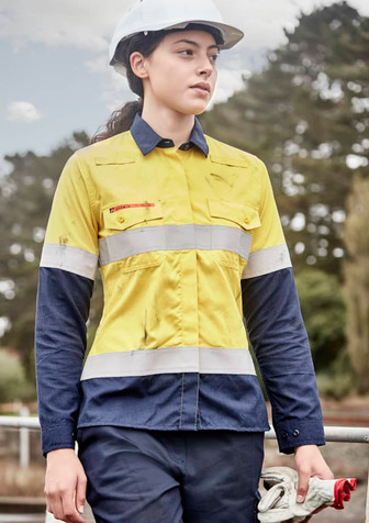 A lightweight women's shirt in orange and navy, featuring reflective taping and a logo. Suitable for workwear.