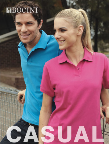A male model in a blue polo shirt and a female model in a pink polo shirt pose together outdoors, with a logo visible.