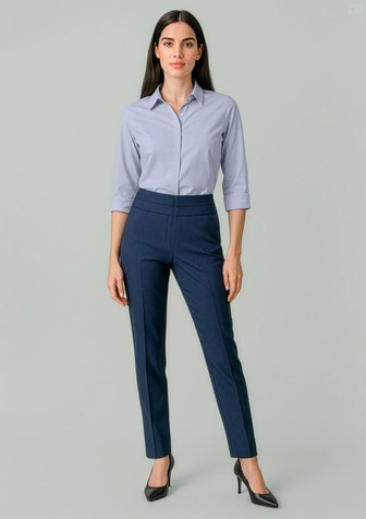 A pair of women's mid-waist slim leg pants in navy blue, featuring a sleek design. The model wears a light blue shirt and heels.